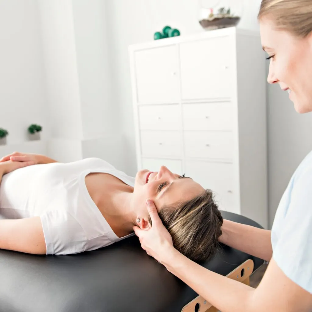 Person holding their head feeling dizziness from a vestibular condition